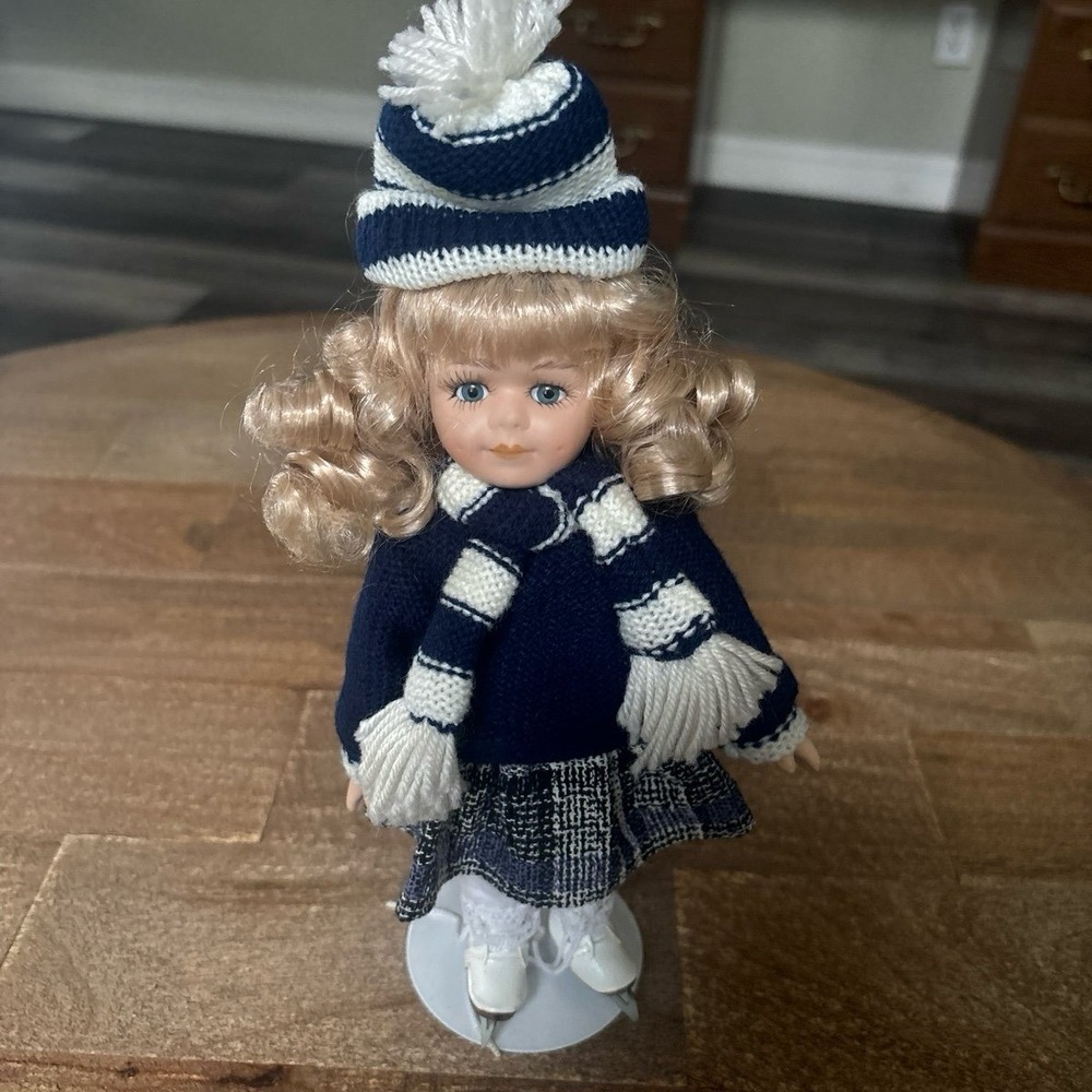 Skater porcelain doll with stand- The broadway‎ collection